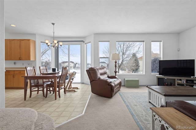 carpeted living room with a notable chandelier