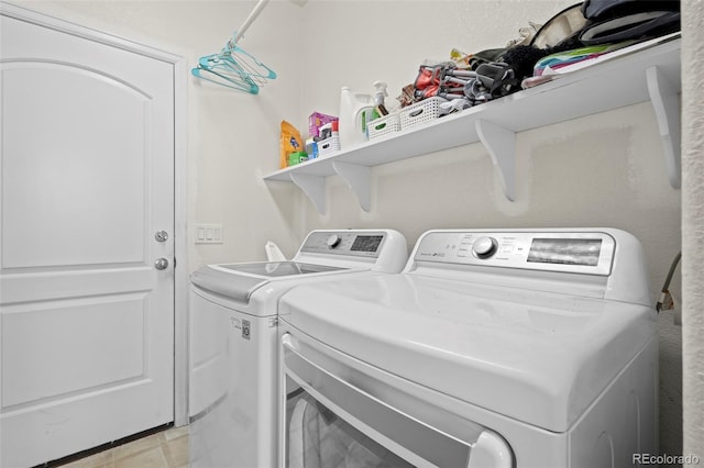 clothes washing area with washer and dryer