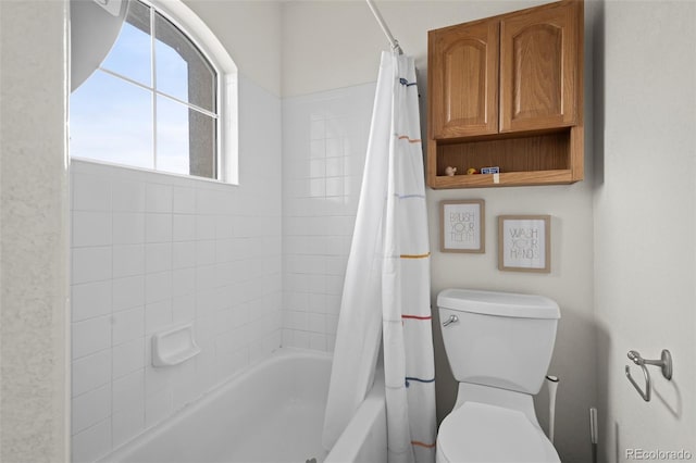 bathroom with toilet and shower / bath combo with shower curtain