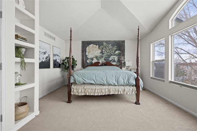 carpeted bedroom featuring vaulted ceiling