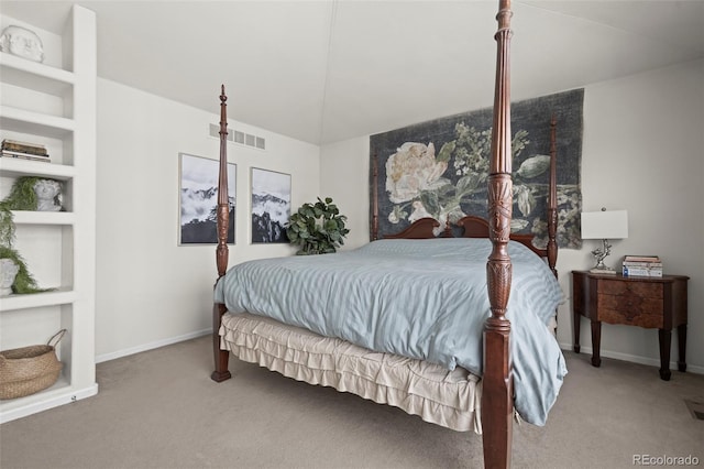 carpeted bedroom featuring vaulted ceiling