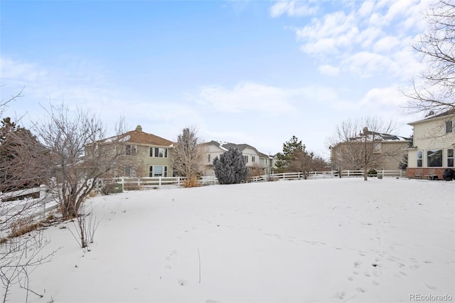 view of yard covered in snow