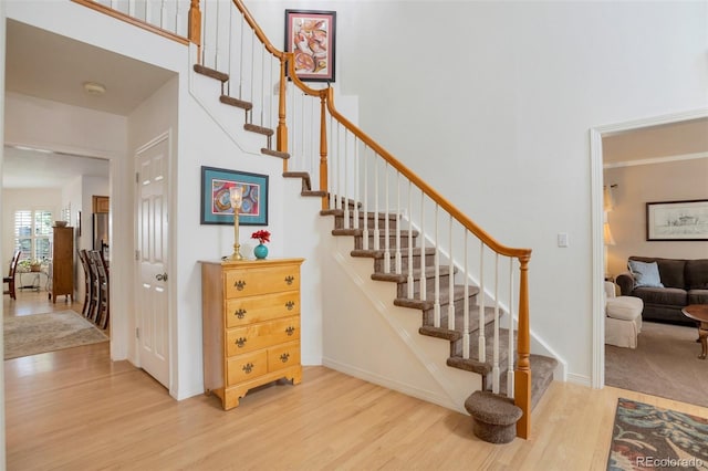 2359 Indian Paintbrush Cir, Highlands Ranch, CO 80129 - staircase with wood finished floors and baseboards