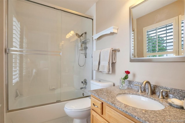 2359 Indian Paintbrush Cir, Highlands Ranch, CO 80129 - bathroom with vanity, toilet, and shower / bath combination with glass door