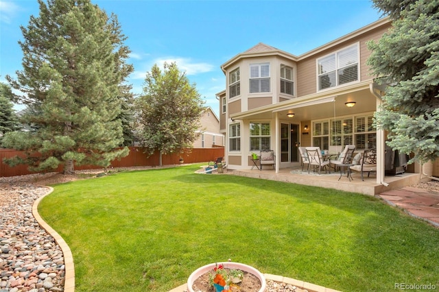 2359 Indian Paintbrush Cir, Highlands Ranch, CO 80129 - rear view of property with a patio area