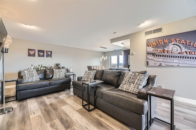 130 N Pearl St Unit 1001, Denver, CO 80203 - living area with baseboards, wood finished floors, and visible vents