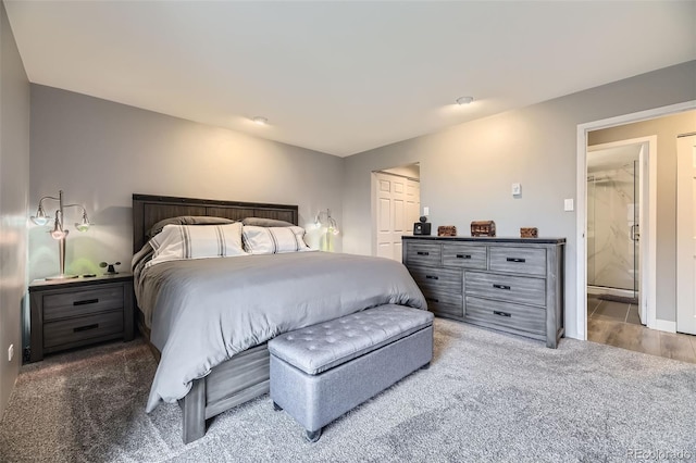130 N Pearl St Unit 1001, Denver, CO 80203 - bedroom with carpet floors, baseboards, and connected bathroom