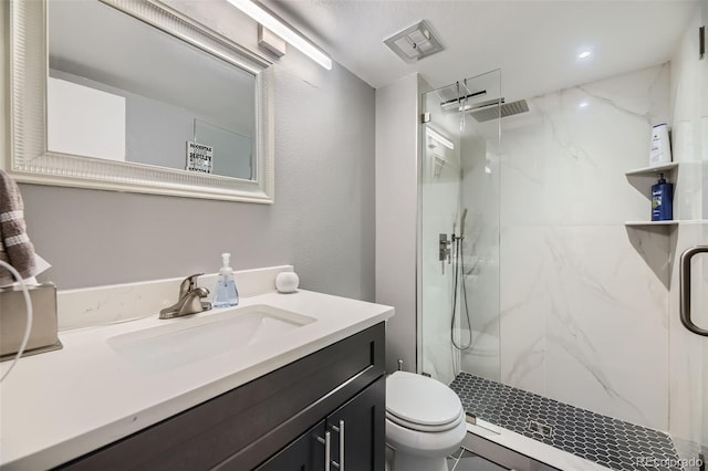 130 N Pearl St Unit 1001, Denver, CO 80203 - bathroom featuring vanity, a marble finish shower, visible vents, and toilet