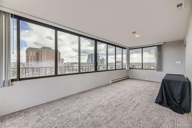 130 N Pearl St Unit 1001, Denver, CO 80203 - unfurnished sunroom featuring a baseboard heating unit, a city view, and visible vents
