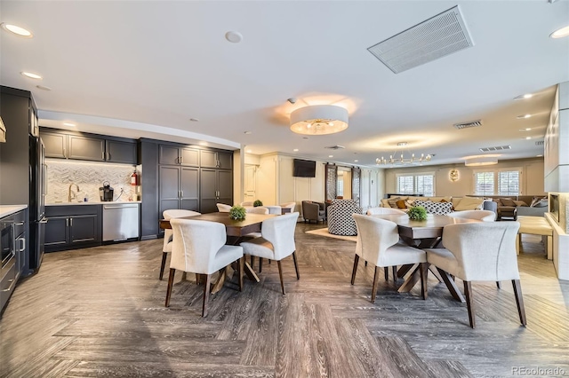 130 N Pearl St Unit 1001, Denver, CO 80203 - dining space with visible vents, recessed lighting, and wet bar