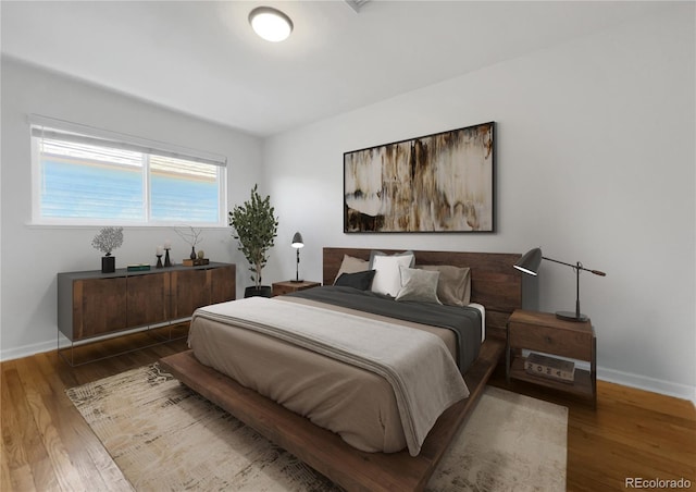 828 Mariposa St, Denver, CO 80204 - bedroom featuring baseboards and wood finished floors