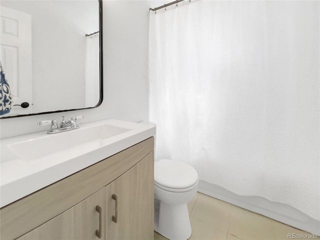 828 Mariposa St, Denver, CO 80204 - full bathroom featuring toilet, vanity, a shower with shower curtain, and tile patterned floors