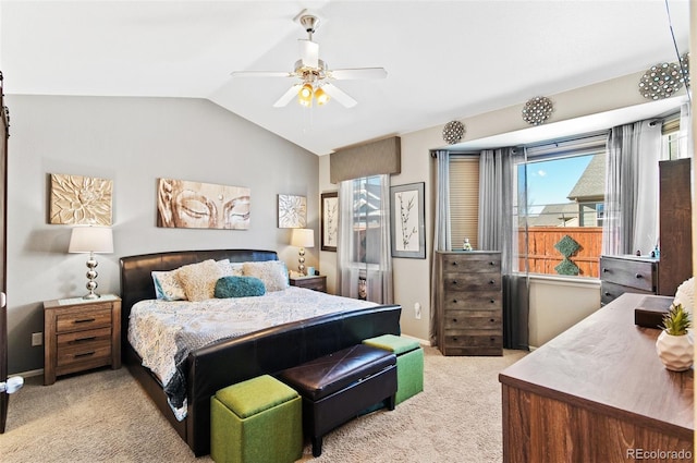 carpeted bedroom featuring vaulted ceiling and ceiling fan