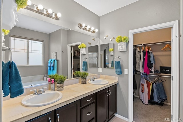 bathroom featuring a bath and vanity