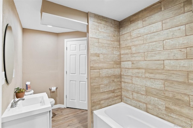 full bathroom featuring shower / washtub combination, hardwood / wood-style floors, vanity, and toilet