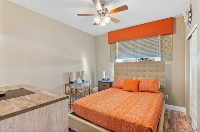 bedroom with ceiling fan and wood-type flooring