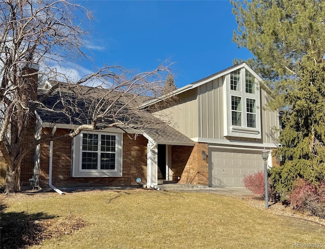 view of front of house featuring a garage and a front lawn