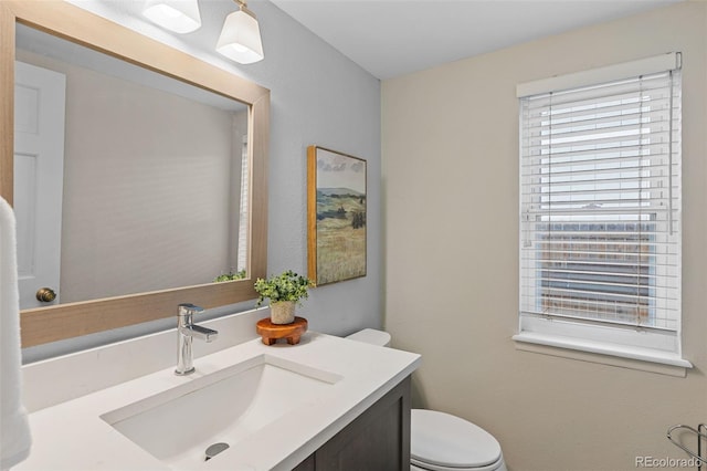 bathroom with vanity and toilet