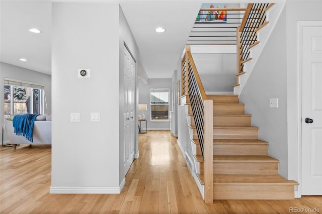 stairway with wood-type flooring