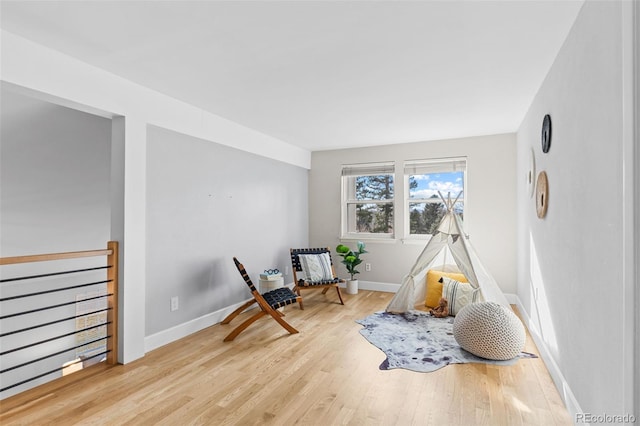 sitting room featuring light wood-type flooring