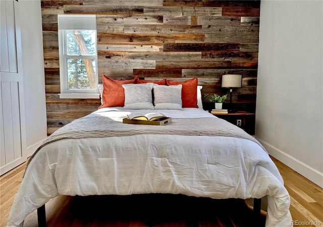 bedroom with hardwood / wood-style flooring