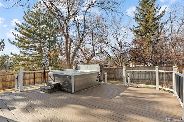 wooden terrace featuring a hot tub