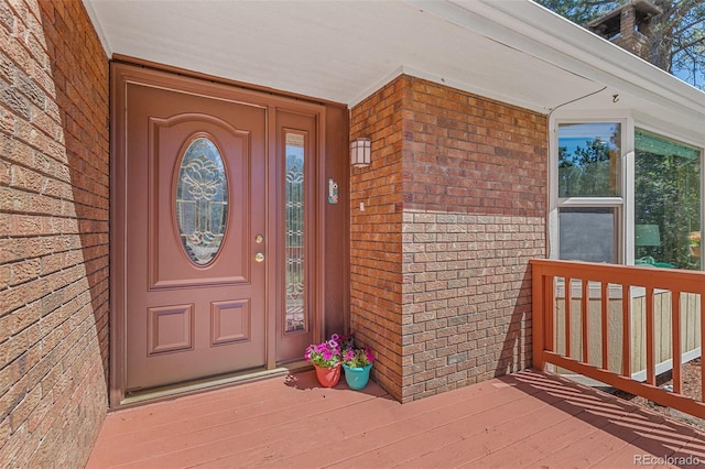 property entrance with brick siding