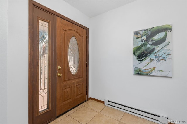 entrance foyer with a baseboard heating unit, light tile patterned floors, and baseboards