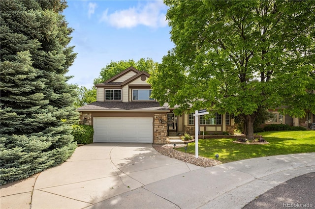 9174 Lark Sparrow Pl, Highlands Ranch, CO 80126 - view of front of home featuring concrete driveway, stone siding, a front yard, and a garage