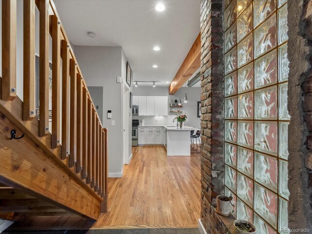 2524 Champa St Unit 1, Denver, CO 80205 - hallway with light wood-style floors, recessed lighting, stairs, and baseboards