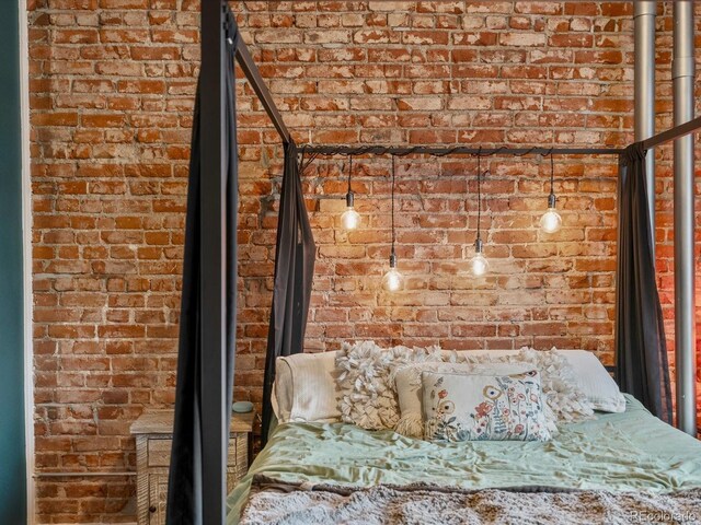 2524 Champa St Unit 1, Denver, CO 80205 - bedroom featuring brick wall