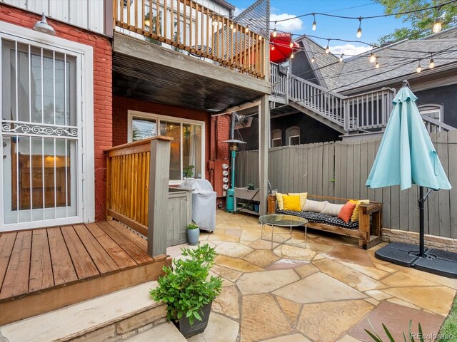 2524 Champa St Unit 1, Denver, CO 80205 - view of patio / terrace featuring area for grilling, a wooden deck, and an outdoor living space