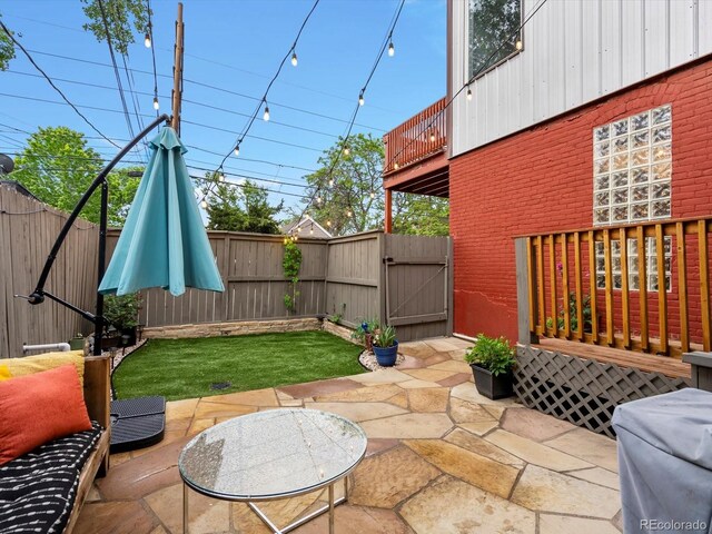 2524 Champa St Unit 1, Denver, CO 80205 - view of patio featuring a gate