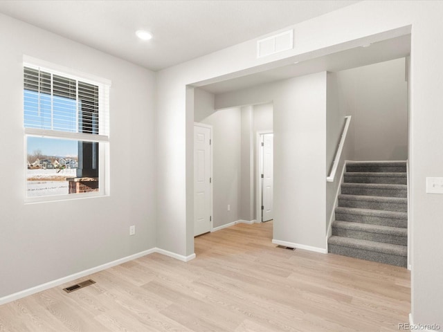 unfurnished room featuring light hardwood / wood-style floors