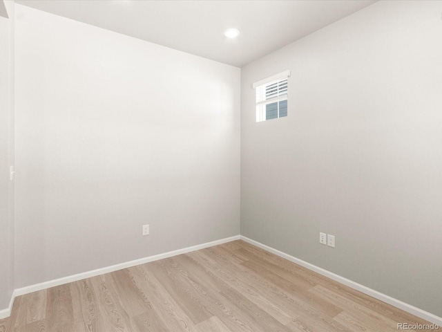 spare room with light hardwood / wood-style flooring