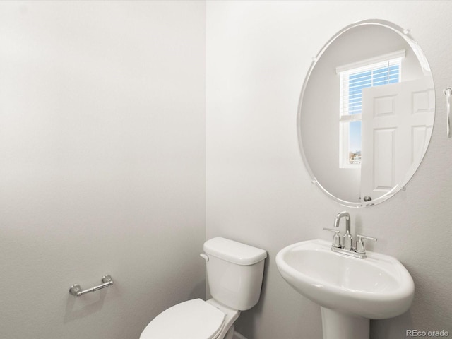 bathroom featuring sink and toilet