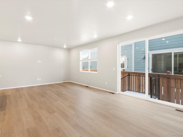 empty room with light wood-type flooring