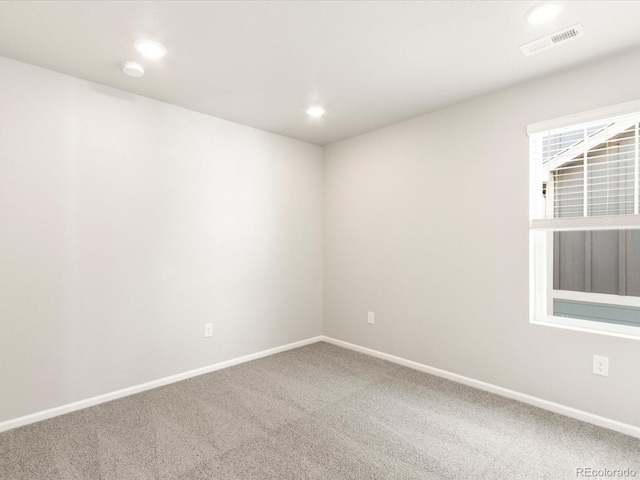 empty room with carpet flooring