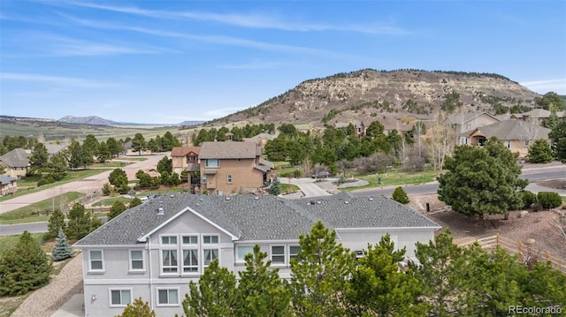 view of mountain backdrop with nearby suburban area