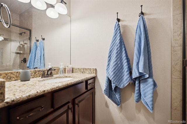bathroom featuring a stall shower and vanity