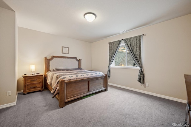 carpeted bedroom featuring baseboards