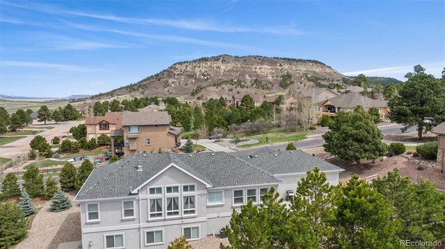 view of mountain backdrop with nearby suburban area