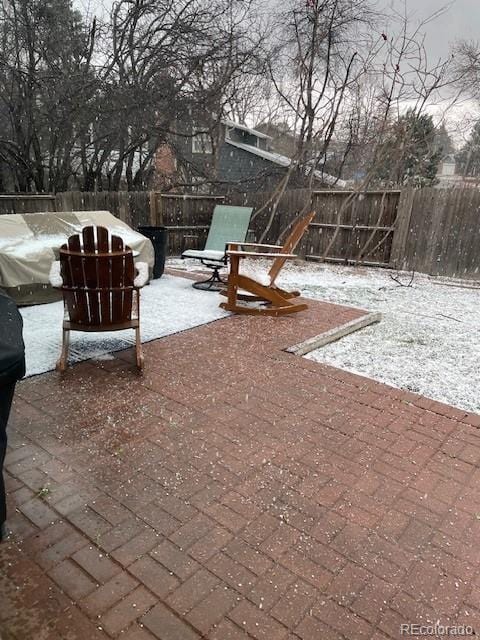 view of snow covered patio