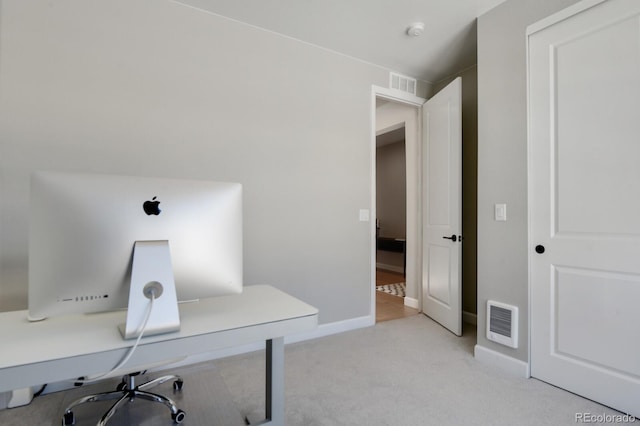 home office featuring light colored carpet