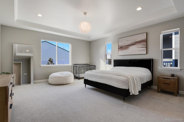 bedroom featuring a raised ceiling, baseboards, light carpet, and recessed lighting