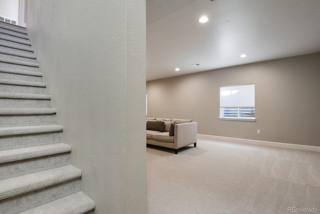 staircase featuring recessed lighting, baseboards, and carpet