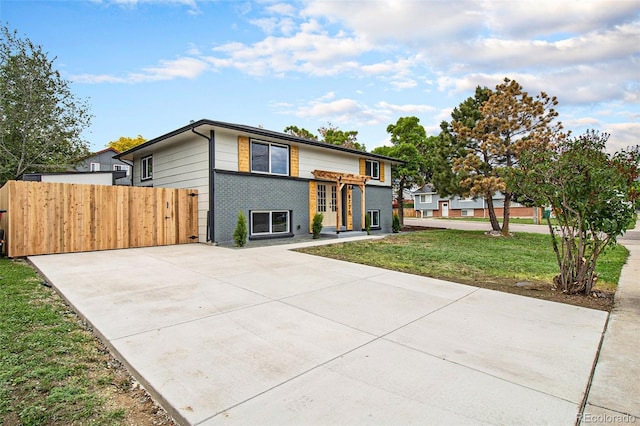 6775 Newland St, Arvada, CO 80003 - view of front of home featuring brick siding