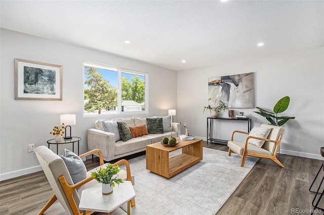 6775 Newland St, Arvada, CO 80003 - living area with wood finished floors, baseboards, and recessed lighting