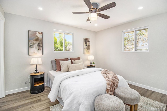 6775 Newland St, Arvada, CO 80003 - bedroom with baseboards, wood finished floors, recessed lighting, and ceiling fan