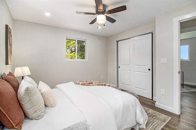 6775 Newland St, Arvada, CO 80003 - bedroom with dark wood-style flooring, baseboards, a closet, ceiling fan, and recessed lighting